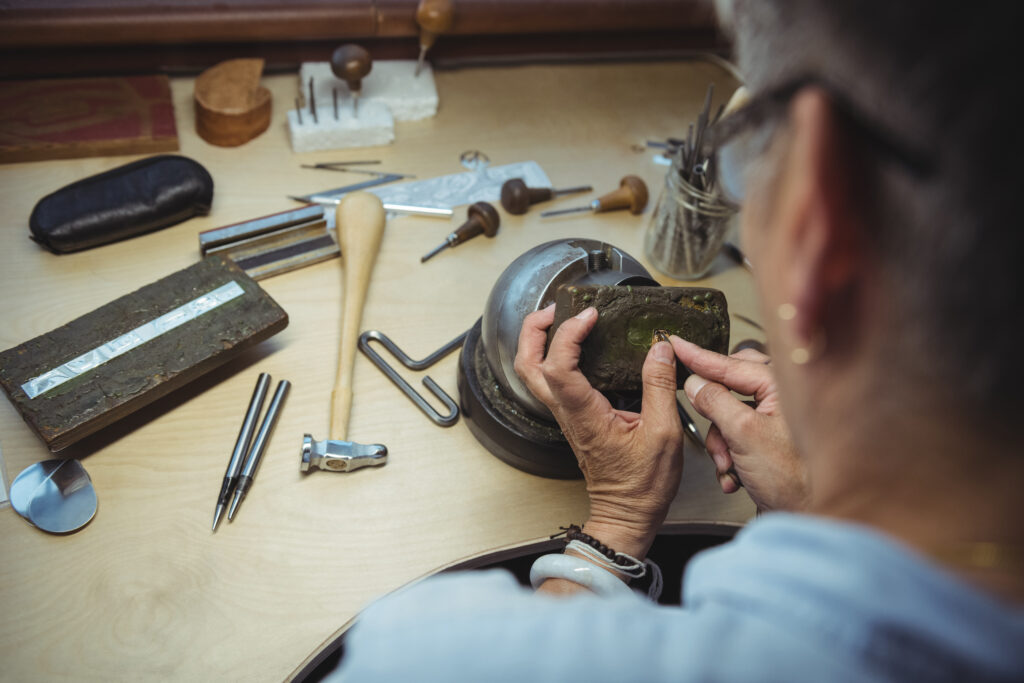 Close-up of craftswoman working in workshop